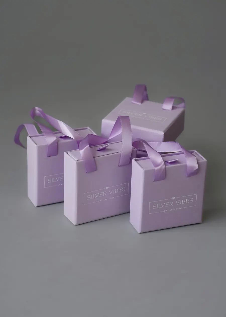 Silver Vibes lilac gift boxes with ribbons